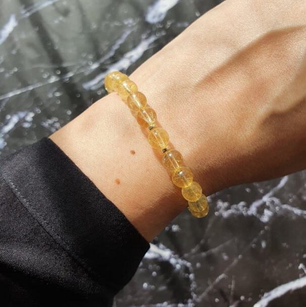 Citrine gemstone bracelet on wrist in natural light – November birthstone jewellery for positivity, success, and warmth.